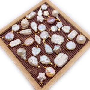 Baroque natural freshwater pearl pendants in heart and star shapes with gold metal bails
