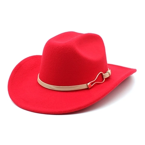Close-up of red wool felt cowboy hat featuring a golden horseshoe buckle detail