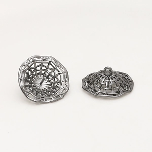 Detail of dark gray hollow mesh metal charms for DIY jewelry making and pendants