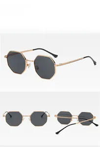 Detailed views of gold octagonal metal frame sunglasses with black polarized lenses