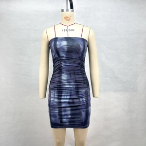 Detailed view of the ruched texture and blue-purple abstract print on the bodycon dress