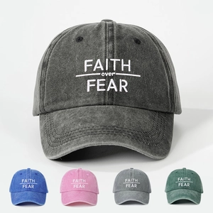 Detail of embroidered FAITH OVER FEAR text on vintage washed cotton baseball cap