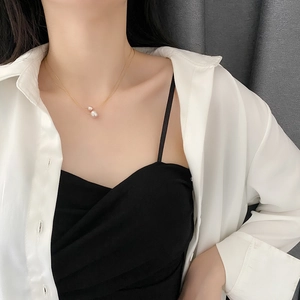 Minimalist titanium steel gold necklace with double natural pearl pendant on model
