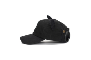 Detail of creative black baseball cap featuring cat ears and pilot goggles decoration