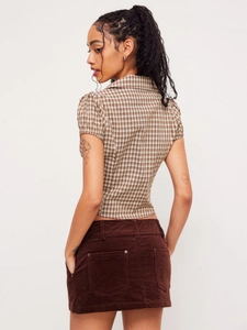 Brown plaid short sleeve shirt and corduroy mini skirt set with a back view focus