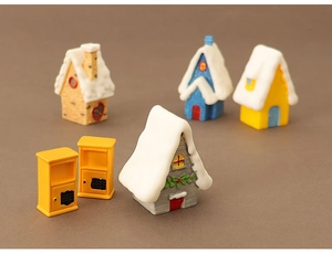 Detailed view of 6-piece miniature Christmas snow houses and decorative resin ornaments