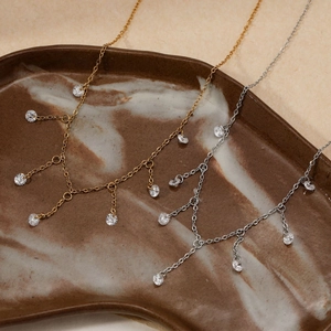 Elegant stainless steel tassel necklace with sparkling zircon charms in gold and silver