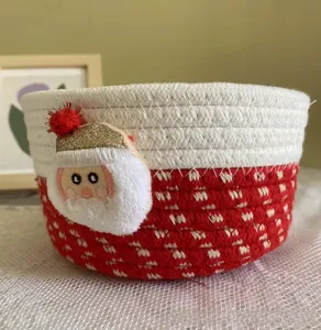 Close-up of a handmade red and white cotton rope basket with Santa Claus 3D detail