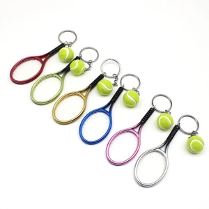 Mini tennis racket and ball keychain set in 6 assorted colors on white background