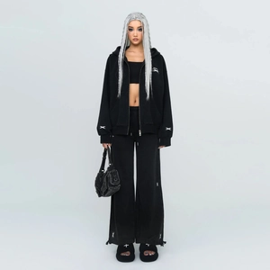 Women's black cotton wide-leg joggers and zip-up hoodie set with white cross logo