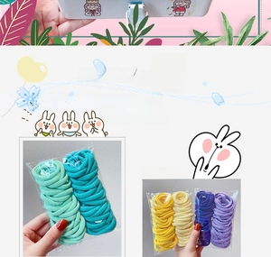 Close-up of seamless elastic hair ties in assorted candy colors in bulk packaging