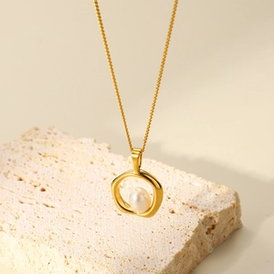 Irregular gold plated stainless steel necklace with natural pearl pendant on stone