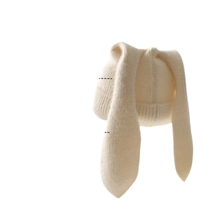 Cute cream plush knitted beanie with long rabbit ears for winter warmth and comfort