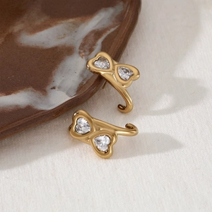 Gold stainless steel bone-shaped stud earrings with heart-cut clear zircon stones