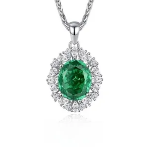 Detailed macro view of S925 silver necklace with green oval emerald pendant and zircon