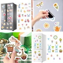 Detail showing various 3D Easter bunny egg magnetic stickers on refrigerator surface