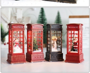 Detailed view of four vintage Christmas telephone booth lanterns with holiday figurines