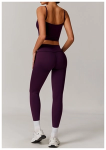 Rear view of dark purple yoga vest and high-waisted leggings in high-stretch fabric