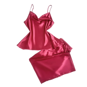 Two-piece burgundy silk satin pajama set featuring a V-neck camisole and long pants