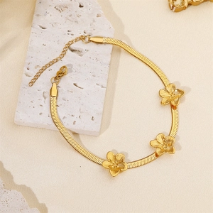 Elegant gold stainless steel snake chain bracelet with three textured flower charms for women