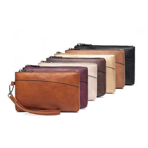Detailed view of variety leather texture wristlet bags in multiple classic colors