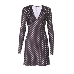 Detail of V-neck collar and stitching on a black long sleeve polka dot mini dress