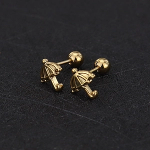 Macro view of gold umbrella stud earrings with polished finish and screw back closures