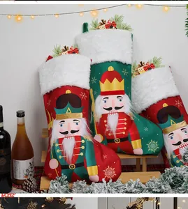 Detail of nutcracker soldier Christmas stockings with plush trim on a wooden shelf