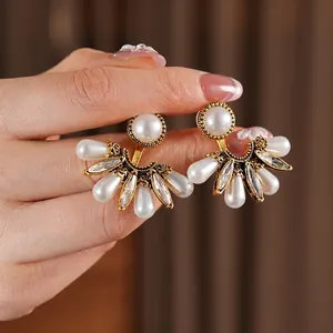 Vintage gold fan-shaped drop earrings with faux pearls and marquise diamonds