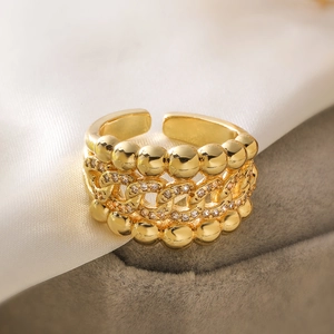 Close-up of 18K gold plated multi-layer geometric open ring with cubic zirconia stones