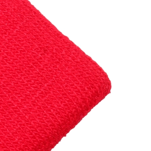 Macro shot of red knitted fabric texture with high-quality embroidery detail and elastic weave