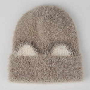 Close-up of fuzzy knit beanie featuring fluffy cat ear patterns and soft faux mink texture