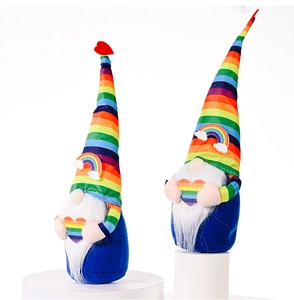 Detailed close-up of rainbow gnome plush toys with striped hats and rainbow heart details