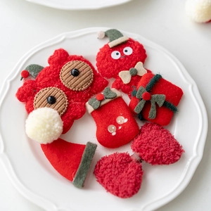 Felt Christmas hair clip set with stocking, gift box, and bow shapes in red and green