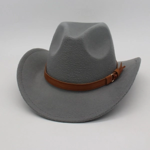 Detailed view of gray felt vintage fedora with brown leather band and gold buckle