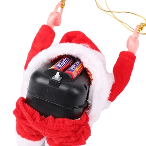 Detailed view of the battery compartment and power switch on the musical Santa ornament
