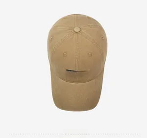 Detail of embroidered FBXS logo and The Stars Are Bright slogan on khaki baseball cap