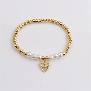 Golden beaded evil eye bracelet with white pearls and sparkling zircon shield pendant