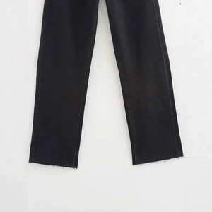Relaxed fit black washed denim jeans with distressed frayed hems and straight leg cut