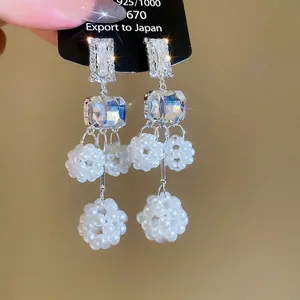 Elegant 925 silver needle drop earrings with hollow rhinestone balls and white pearls