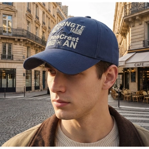 Detailed white mountain embroidery on a navy blue vintage cotton baseball cap