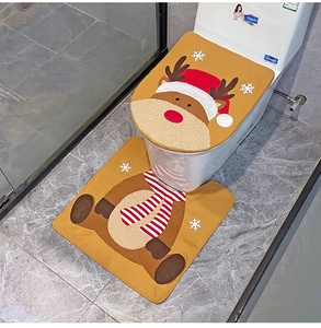 Close-up of ginger reindeer toilet seat cover and U-shaped mat for Christmas bathroom decor