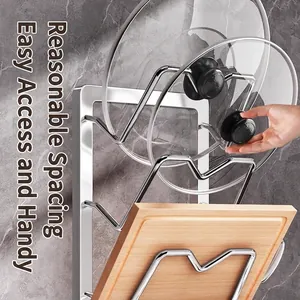 Wall-mounted stainless steel rack with three tiers holding pot lids and a wooden cutting board