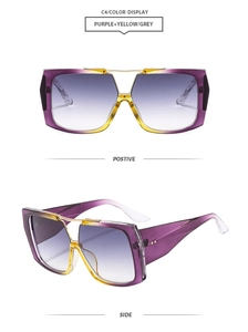 Detail of pilot sunglasses with purple and yellow gradient frame and golden metal bridge