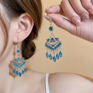 Vintage bohemian silver dangle earrings with blue stones and mandala filigree tassels