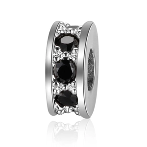 Macro view of silver plated wheel spacer bead with black cubic zirconia for DIY jewelry