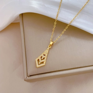 Elegant gold-tone arrow pendant necklace with sparkling cubic zirconia on silk