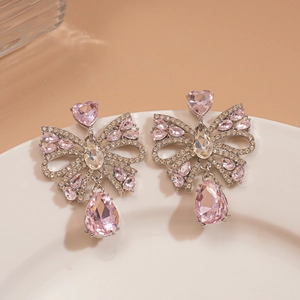 Boucles d'oreilles nœud en strass roses avec cristal cœur et pendentif poire
