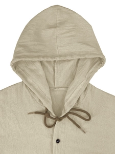 Detail view of linen hoodie neckline featuring drawstring hood and single button closure