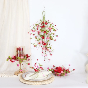 Detail of red floral heart swag and tabletop decorations for Valentine wall decor